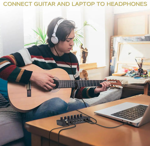Person playing guitar connected to Six Channel Portable Mini Audio Mixer With 6.35mm To 3.5mm Adapters for laptop recording