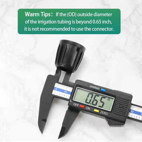 Focus Keyword: 14 Pack One Half Inch Drip Tubing Elbow Fittings With Barbed Lock Nuts For Garden Irrigation Systems One Half Inch ID By Sixteen Millimeter OD 90 Degree Elbows No Brainer Install Anti Drop Connectors For Lawn. Digital caliper showing 0.65 inches measurement.