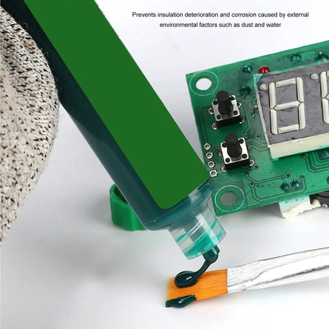 UV Cure Solder Mask Ink For PCB Protection being applied with brush, oil resistant mask paste near electronic circuit board.