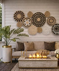 11 Piece Retro Boho Wall Basket Decor Set With Black And Natural Woven Baskets For Living Room Bedroom And Kitchen Rustic Farmhouse Wall Art Handmade Hanging Basket Display installed on a patio wall.