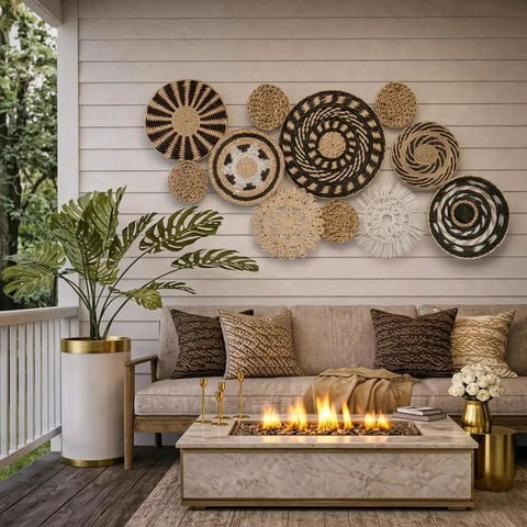 11 Piece Retro Boho Wall Basket Decor Set With Black And Natural Woven Baskets For Living Room Bedroom And Kitchen Rustic Farmhouse Wall Art Handmade Hanging Basket Display installed on a patio wall.