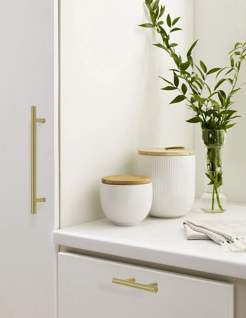 Kitchen setting featuring 7 Inch Center To Center Golden Champagne Cabinet Pulls Set Of 10, Nine And Three Eighths Inch Overall Length