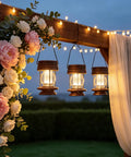 Two Pack Solar Lanterns Outdoor Lighting For Patio And Garden hanging with warm glow under floral archway