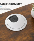 Cable grommet on a wooden desk surface, ensuring neat cable management for the 63 By 30 Inch Heavy Duty Dual Motor Electric Standing Desk.