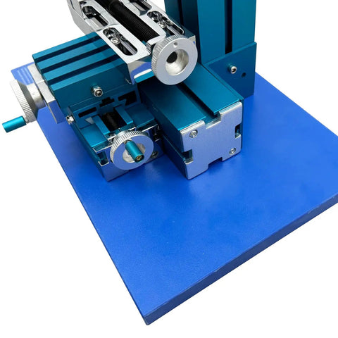 Close-up of Garage Ready Mini Metal Milling Machine With Benchtop Lathe And Slick Precision Vise showing adjustable axes and clamps.