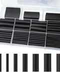 Dope Heat Shrink Tube Set With 150 Pieces And 8 Sizes For Snazzy DIY Wrapping, 3:1 Ratio Adhesive Lining Cable Sleeves Perfect For Everyday Repairs And Cool Projects In Sleek Black. assorted black heat shrink tubes in organizer case, 8 sizes
