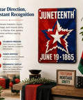 Juneteenth plaque with red, white, and blue star design, June 19, 1865 date, displayed on wall with plants and flags