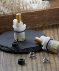Two Handle Faucet Stem Replacement Kit With Cartridge RP4993 Seat And Spring on slate surface
