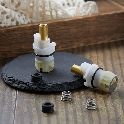 Two Handle Faucet Stem Replacement Kit With Cartridge RP4993 Seat And Spring on slate surface