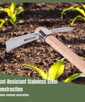 Stainless Steel Garden Pickaxe Handheld Mattock in soil, rust-resistant construction with wooden handle for gardening