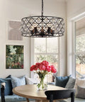 Five Light Drum Crystal Chandelier with K9 Crystals in rustic retro style above dining table in a living room.