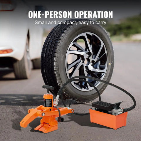 Hydraulic Bead Breaker With 10000 PSI Power And Metal Foot Pump Heavy Duty Steel Tool next to a car tire for easy bead separation