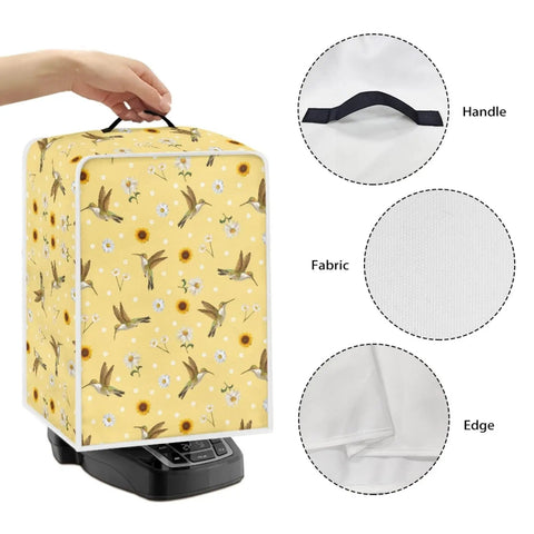 Slick Hummingbird Floral Coffee Maker Cover showing handle, fabric texture, and edge design on kitchen counter.