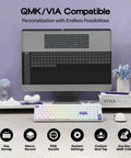 Premium Low Profile Aluminum Mechanical Keyboard With Full Via Programming Hot Swappable Switches Compact One Zero Layout built beside a monitor with RGB backlighting.