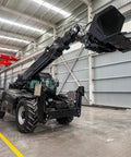 Heavy Duty Four Wheel Drive Telehandler Forklift With Extended Reach Boom for smooth material moves in a warehouse.