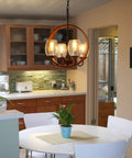 Industrial chandelier with round wood and metal design, three glass lights, hangs over kitchen dining table, rustic style.