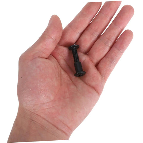 Single black bed screw held in hand from No Sweat Setup Top Shelf Bed Screw And Bolt Set For Furniture Frames Cabinet Joints 170 Piece Heavy Duty Connecting Hardware Kit You Gonna Love.