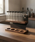 Premium Two Tier Coffee Bean Storage Rack With Wooden Base And Twelve Clear Glass Jars Featuring Air Release Vents For Crisp Freshness And Top Shelf Kitchen Counter Organization Straight Fire Setup on a wooden countertop with glass jars.