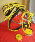Yellow and black nylon horse driving harness full size for carriage and training durable nylon tack set lightweight yet strong cushioned comfort adjustable straps safe easy fit great for all day driving displayed on a red background
