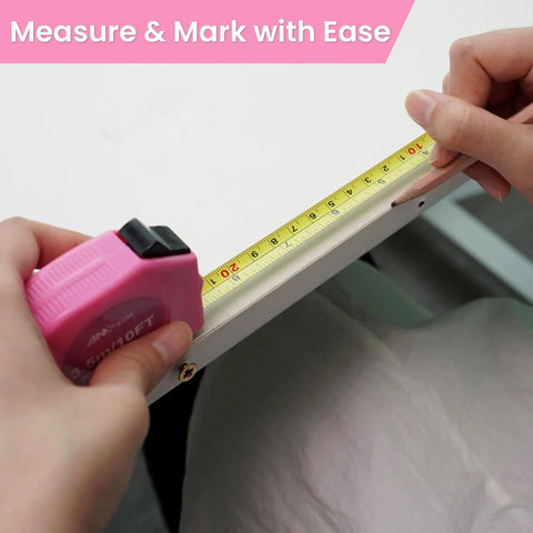 Person measuring edge of table with pink tape measure from Must-Have Women 136-Piece Home DIY Tool Set With Rose Toolbox Portable Hand Tool Kit For Home Repairs And Car Maintenance Cute Yet Rugged Gift For Ladies Everyday.