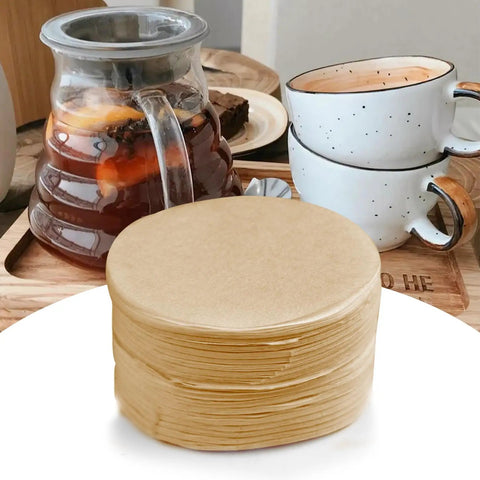Round 56mm Disposable Coffee Filter Papers 200 Pack For Moka Pots And Drip Makers Unbleached Natural Paper shown with cups