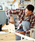 Man using Killer 20V Cordless Drill Set With 2.0 Ah Battery And Charger 30 Nm Torque on wooden furniture assembly.