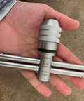 Hand holding adjustable ratcheting T handle tap wrench for fast accurate thread tapping M6 to M14, dual handles visible