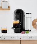 Vertuo Plus Single Serve Coffee And Espresso Maker By Breville In Ink Black With 25 Second Heat Up And Auto Shut Off For Quick One Touch Brews And Rich Flavor Every Morning on a kitchen counter