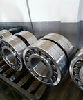 Pro Grade Spherical Roller Bearing 22207cc W33 35x72x23mm on a conveyor system for industrial use.