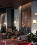 Cozy living room with Teardrop Glass Globe Wall Sconce Plug In Two Pack In Brushed Gold Finish Mid Century Modern Drop Design Milk White Shade