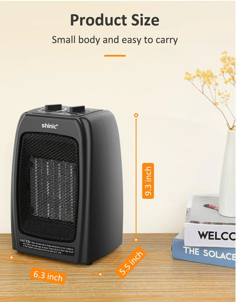 Compact Ceramic Space Heater With 1500W And 900W Modes, Black, on desk, product dimensions 9.3x6.3x5.5 inches, next to decor