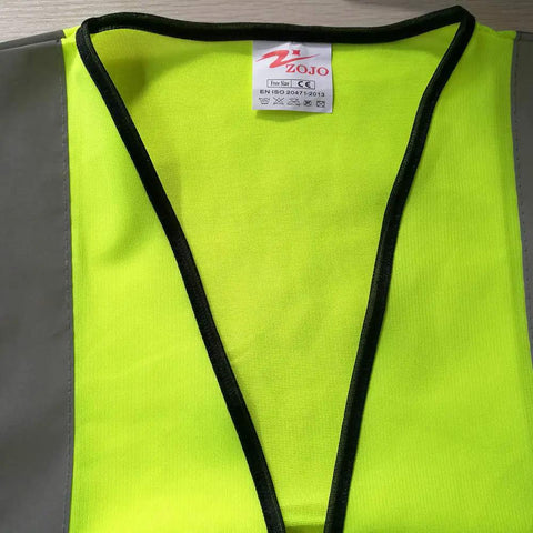 Close-up of Must Have High Visibility Reflective Safety Vest showing front panel and tag, neon yellow mesh, adjustable fit.
