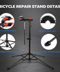 Floor Bike Repair Stand With Height Adjustable Arm And Tool Tray For Road And Mountain Bikes, Beefy 66 Lb Capacity, 360 Degree Swivel Clip, Durable Iron And PA Construction, Red And Black detailed view showing clamping device, magnetic tool tray, and support frame.