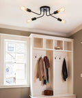 Industrial Semi Flush Mount Four Light Ceiling Fixture With Adjustable Black Metal Branches, E26 Base installed in entryway