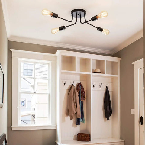 Industrial Semi Flush Mount Four Light Ceiling Fixture With Adjustable Black Metal Branches, E26 Base installed in entryway