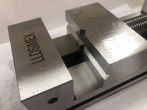 Precision Toolmakers Vise Grinder With Dead On Center Flat Tongs For Surface Grinding Milling And Edm Rig shows metal jaws with precise profile.