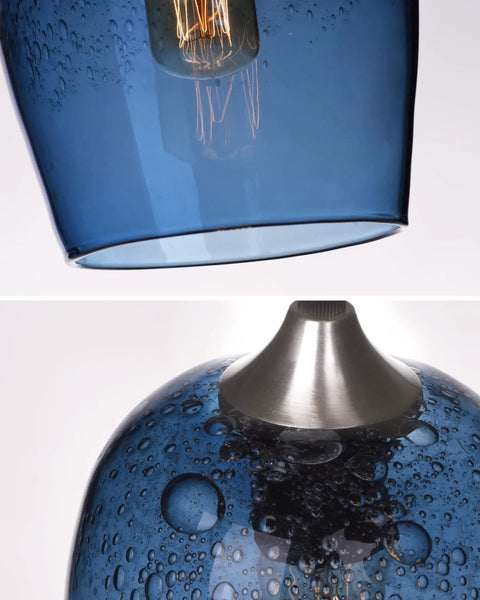 Close-up of Capri Blue Teardrop Glass Pendant Lights Set showing bubble art detail and stainless steel fixture top view.