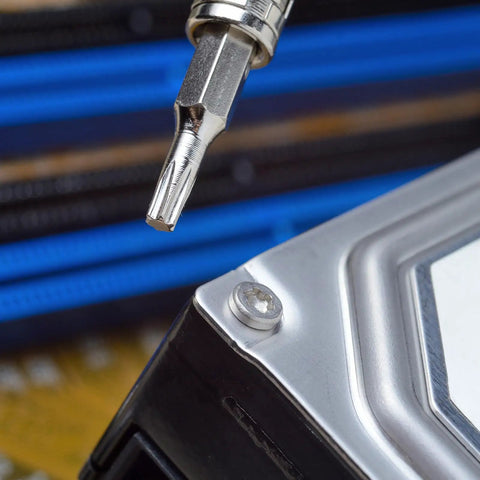10 Piece Torx Bit Set With 28mm Long Bits, Precision S2 Alloy Steel, T1 To T10 in use on electronic component