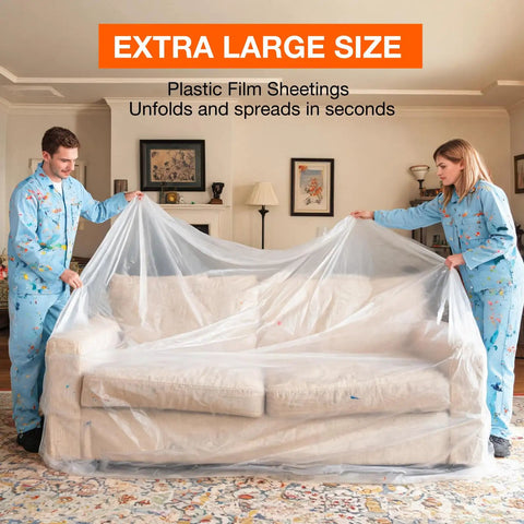 Two people covering a sofa with clear plastic drop cloths 10 pack 9x12 ft tarp for painting protect furniture floors sofas and surfaces mess free