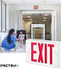 Hardwired Red LED Exit Sign With Battery Backup, Dual Face Emergency Light in hospital hallway with nurse and patient in wheelchair
