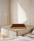 Premium Walnut Wood Jewelry Tray With 15 Grid Compartments, placed elegantly on a home desk, perfect for organization.