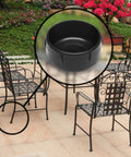 These Dang Tough Nylon Glide Caps For Wrought Iron And Metal Patio Furniture Are Heavy Duty Replacement Floor Protectors That Keep Your Deck Scratch Free And Totally Looking Fresh, shown on chair leg.