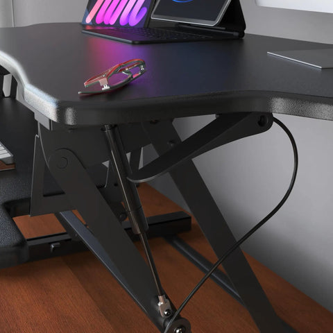 Standing Desk Converter 48 Inch Wide Sit Stand Desk Riser With Dual Gas Spring Handles, side view with laptop and glasses