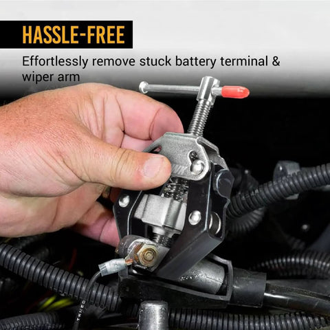 Pro Grade Auto Wiper Arm Puller And Battery Terminal Tool in use, showing adjustable design removing stuck battery terminal.