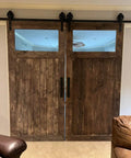 Straight Up Premium Aging Wood Stain In Ranchworn on indoor sliding barn doors with windows, showcasing rustic wood finish.