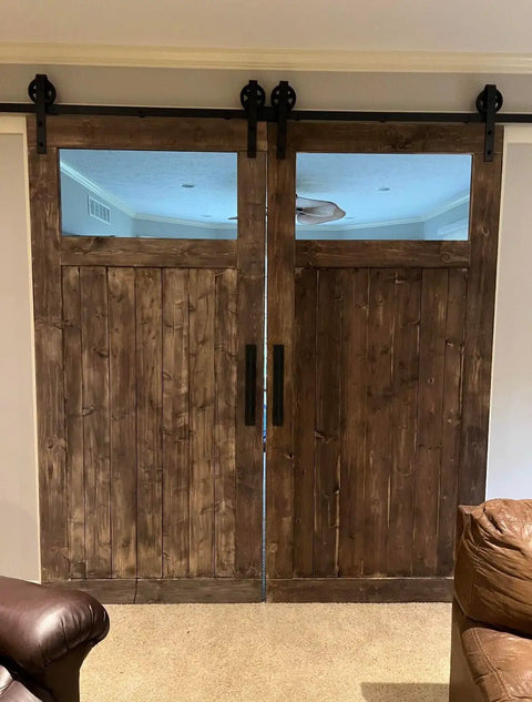 Straight Up Premium Aging Wood Stain In Ranchworn on indoor sliding barn doors with windows, showcasing rustic wood finish.
