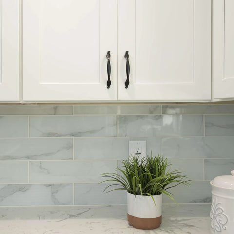 White cabinet with Solid Zinc Alloy Cabinet Pull Handle In Oil Rubbed Bronze, 7 Inch Overall Length, installed in a kitchen.