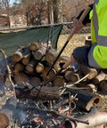 Person using 42 Inch Fire Tongs And Fire Poker Set Beefy Heavy Duty Detachable Log Grabbers for firewood handling outdoors