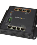 Rock Solid Eight Port Gigabit PoE Switch With Four Powered Ports And One Twenty Watt Budget featuring industrial steel housing with eight Ethernet ports.