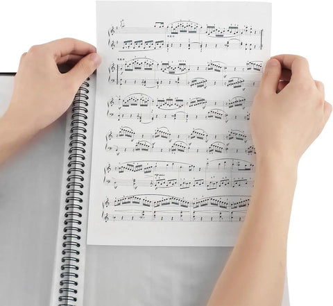 Hands placing sheet music in 60 Pocket Portfolio Binder With Plastic Sleeves 120 Page File Organizer For Artwork Sheet Music Documents And Diamond Painting Great For School Projects And DIY Crafts